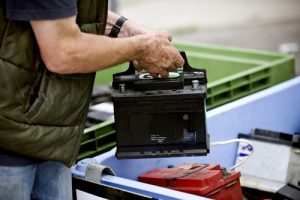 ASeniorManRecyclingACarBattery - Meineke Car Care - Texas Meineke Car Care | Car Battery | Lewisville